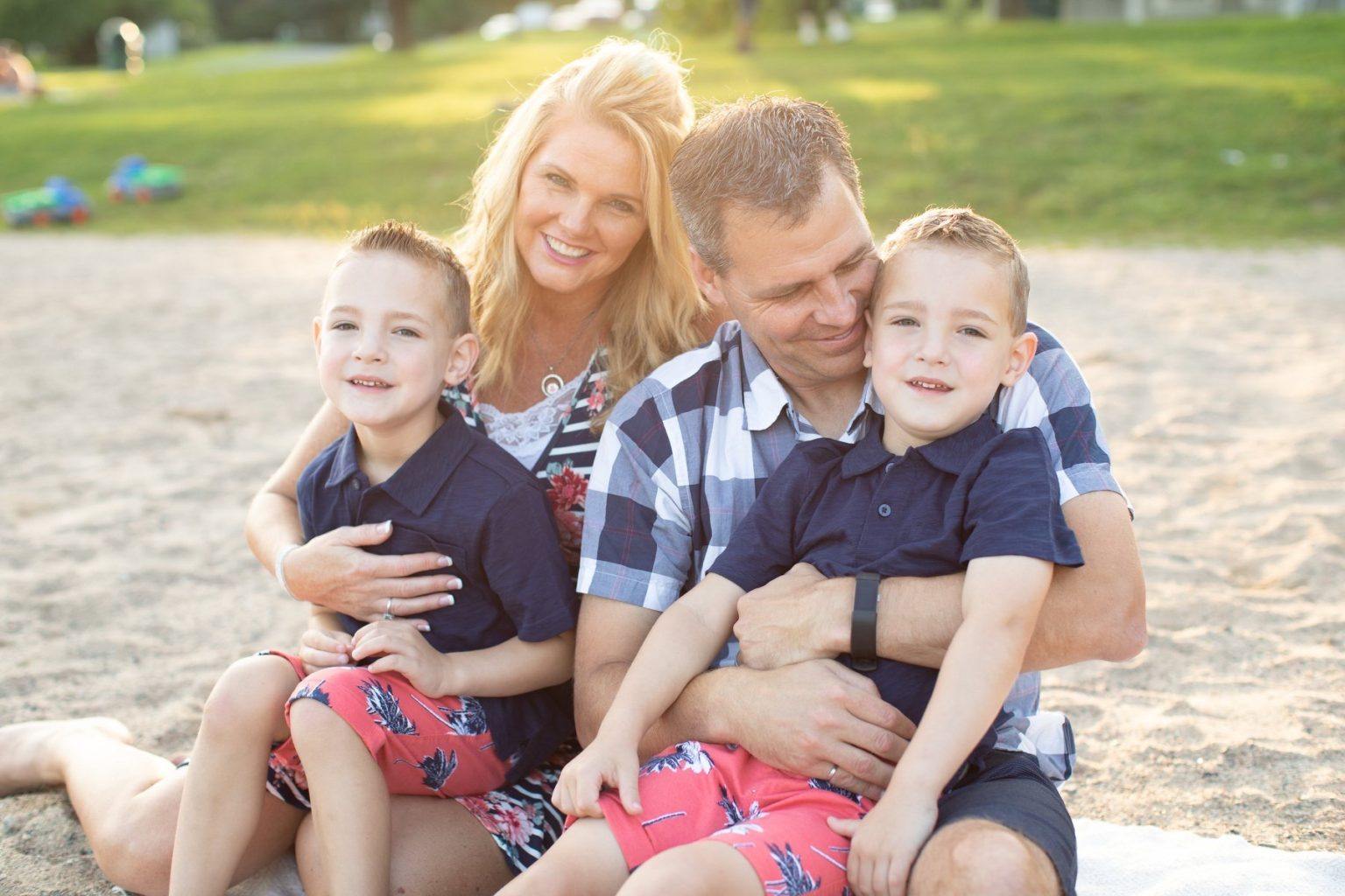 Stacey Killam with husband and two twin sons