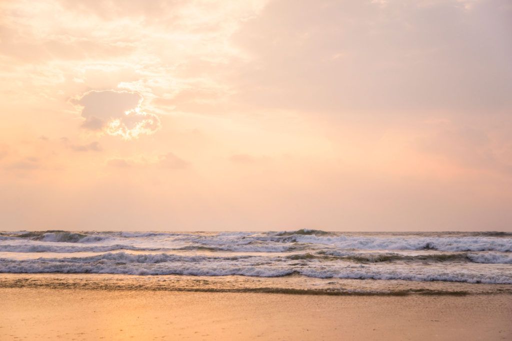 Sunset at a beach. Orange tones and copy space.